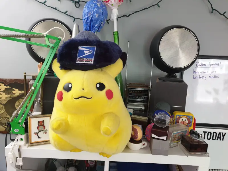 Somewhere behind Pikachu, there's a radio collection.
